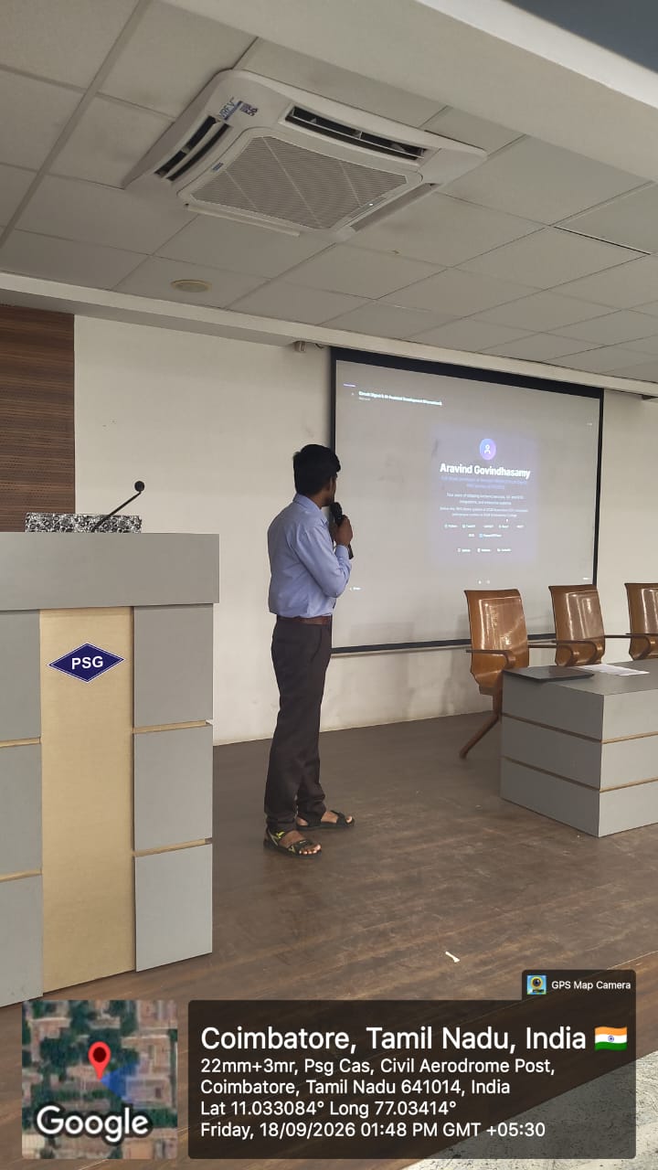 Presenting in Sathyam Hall with the title slide on screen
